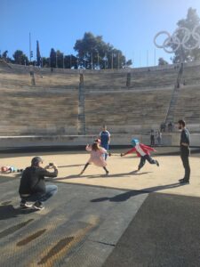 A european family fencing in the Panathenaic  Stadium